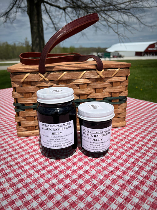 Amish Country Store black raspberry jam jar with label, showcasing the Amish-made Amish jam and fresh black raspberries.