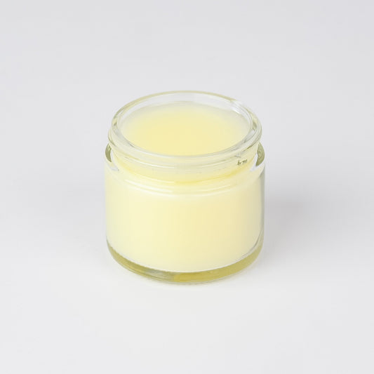A 2oz jar of The Lady May Unscented Tallow Cleansing Balm with grass-fed beef tallow and castor oil, used as a natural makeup remover.