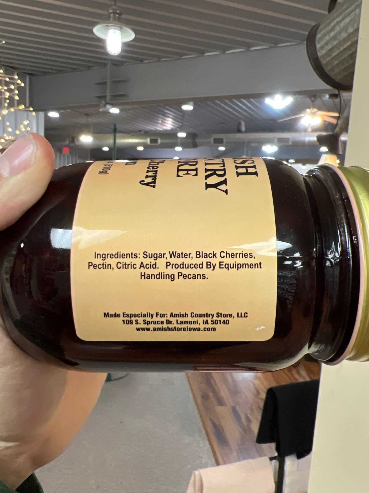 Canned black cherry jam in 18 oz jar from Amish Country Store, showcasing the rich dark cherry spread in a glass jar