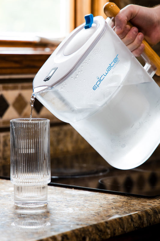 Epic Water Filters Pure Pitcher reducing fluoride and PFAS, with a sleek red design, for clean, filtered drinking water.