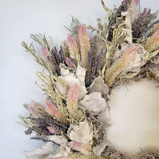 Handmade dried flower wreath in blush tones from Sunny Meadows Flower Farm, featuring dried blooms and natural foliage.