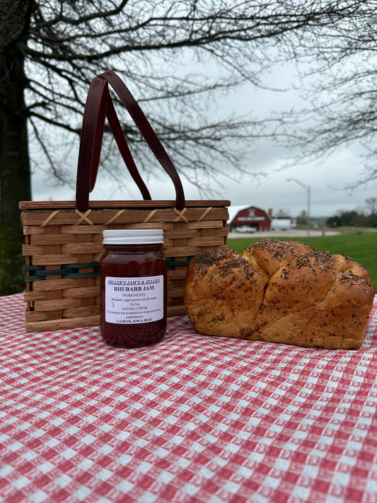 Amish Country Store Miller's Rhubarb Jam jar showing vibrant red rhubarb jam in a clear glass jar with label.