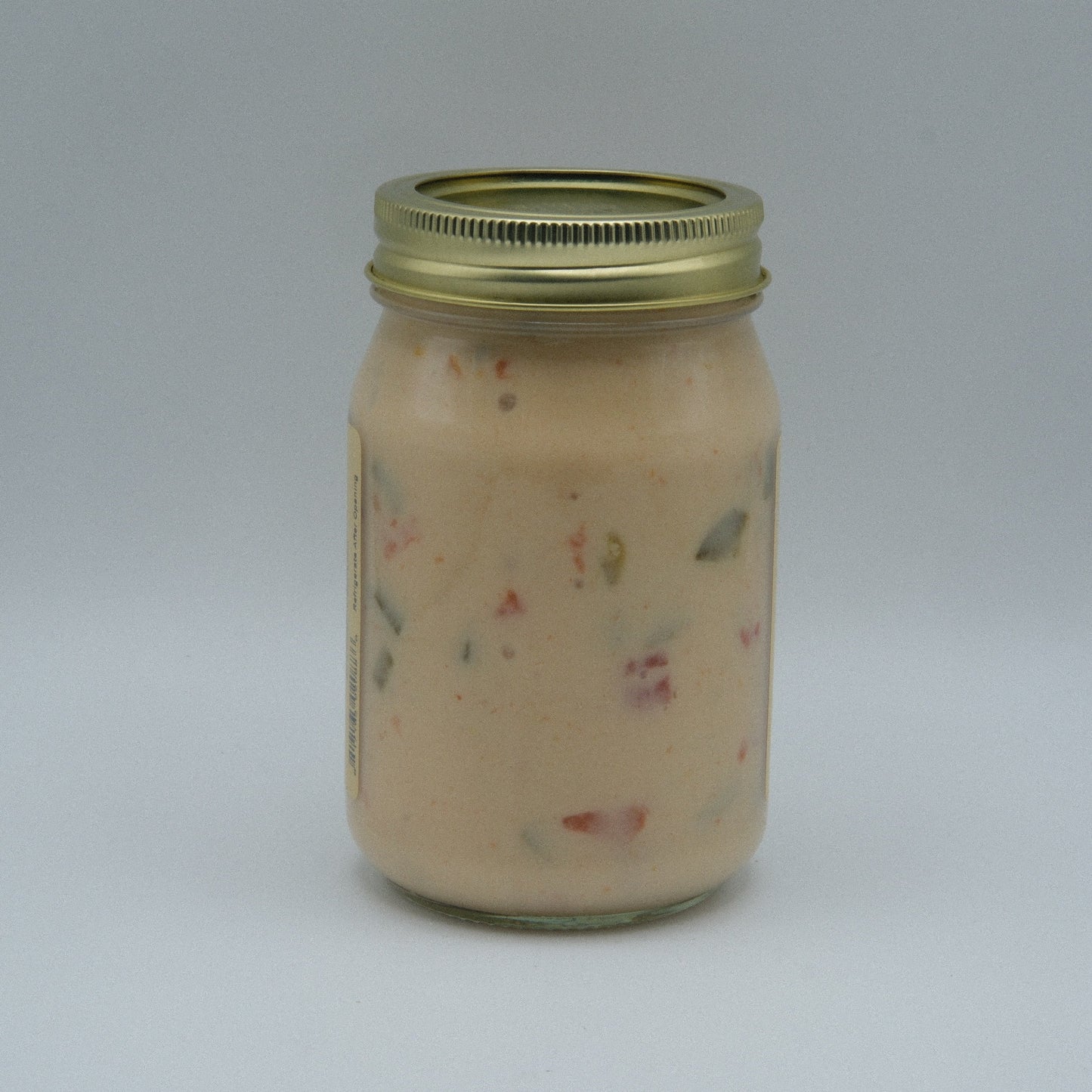 Canned Amish Country Store Queso Blanco cheese in 16 oz can, creamy white cheese with smooth texture and label visible.