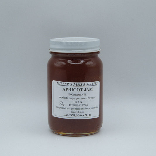 Amish Country Store Miller’s Apricot Jam jar with apricot pieces and jam spread, close-up of the Amish-made fruit preserve