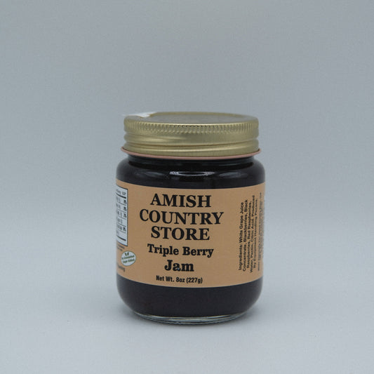 Canned Amish Country Store Triple Berry Jam in 8 oz jar, no added sugar, with fresh berries visible through the glass.