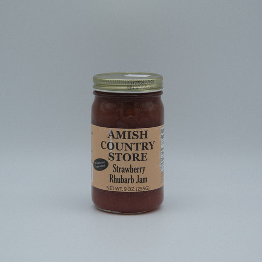 Canned Strawberry Rhubarb Jam in 8 oz jar from Amish Country Store, no sugar added, with fresh strawberries and rhubarb visible.