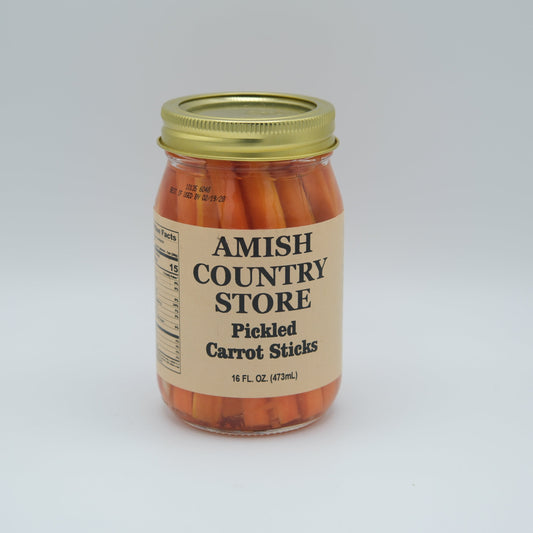 Canned pickled carrot sticks in a 16oz jar from Amish Country Store, showing colorful carrot sticks immersed in pickling liquid.