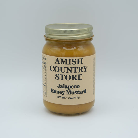 Canned Jalapeno Honey Mustard from Amish Country Store in a glass jar, showcasing the spicy mustard with jalapeno peppers.