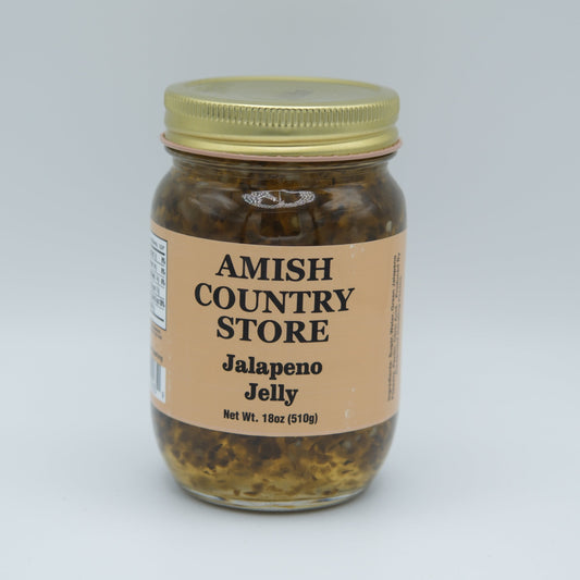 Amish Country Store jalapeno jelly in 18oz canned jar, bright green jalapenos in clear glass jar, ready for spreading or tasting.