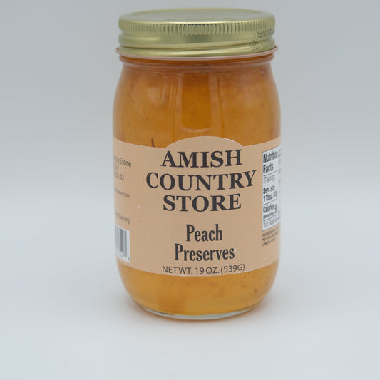 Canned peach preserves in a 16oz jar from Amish Country Store, showcasing golden peach jam with a smooth texture.