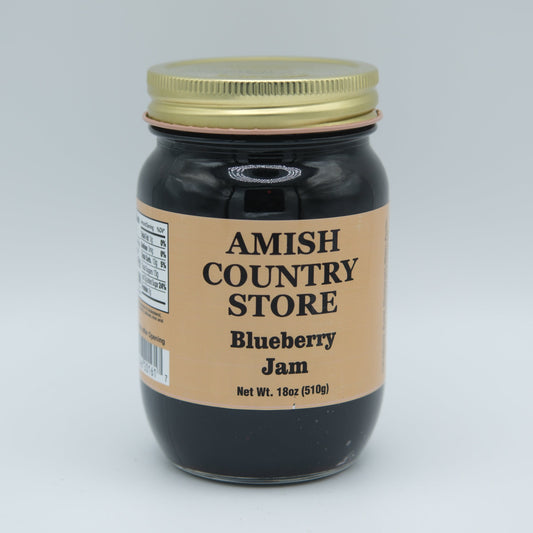 Canned blueberries jam in 18 oz jar from Amish Country Store, showing the blue jam inside a glass jar.