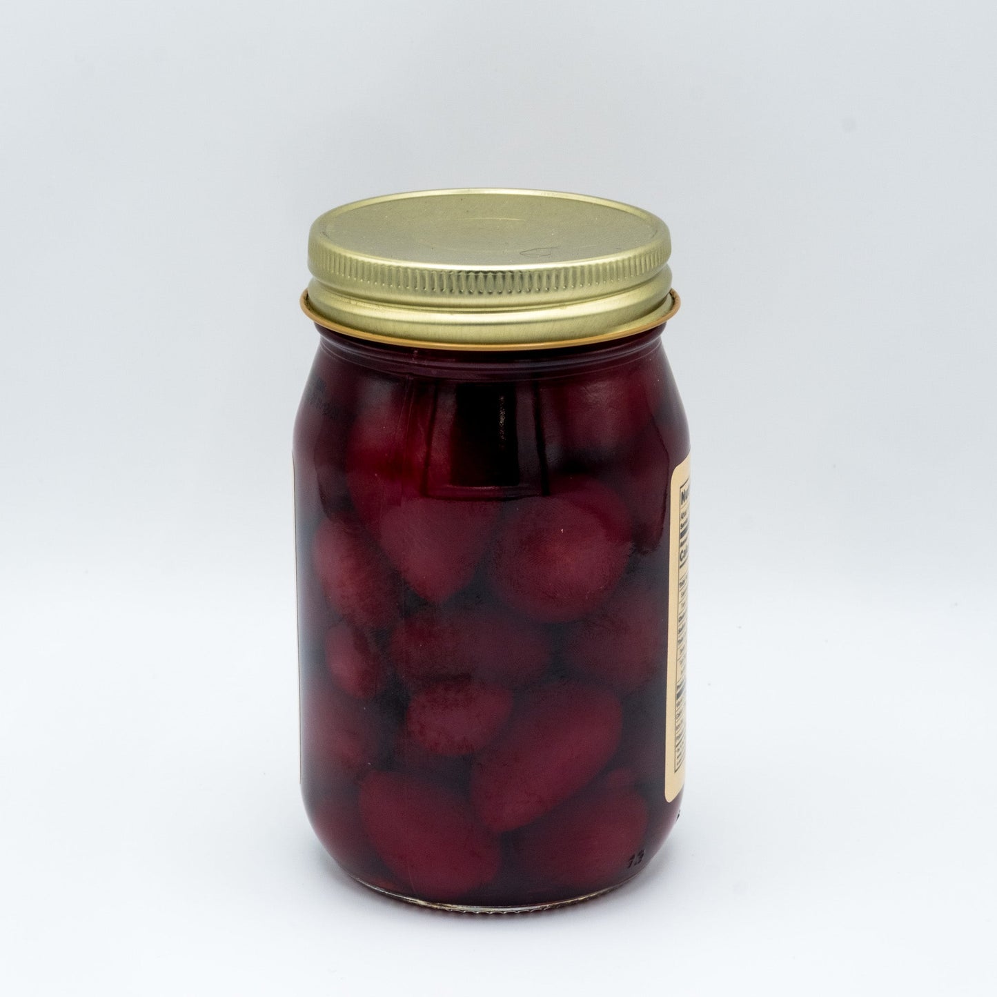 Canned Amish Country Store pickled baby beets in a 32oz jar, showing vibrant red beets immersed in pickling liquid.