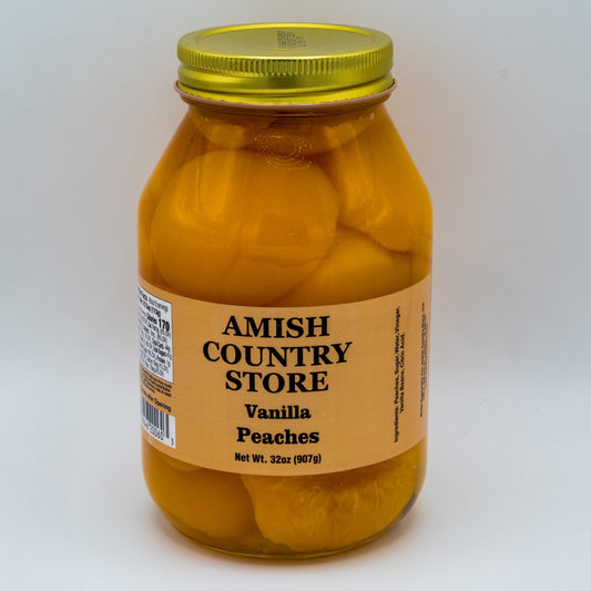 Canned vanilla peaches with real vanilla beans in a 32oz jar from Amish Country Store, showcasing the fresh fruit and vanilla bean pieces.