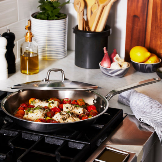 Heritage Steel 12-inch fry pan with lid, durable cookware with stainless steel construction and ergonomic handle.