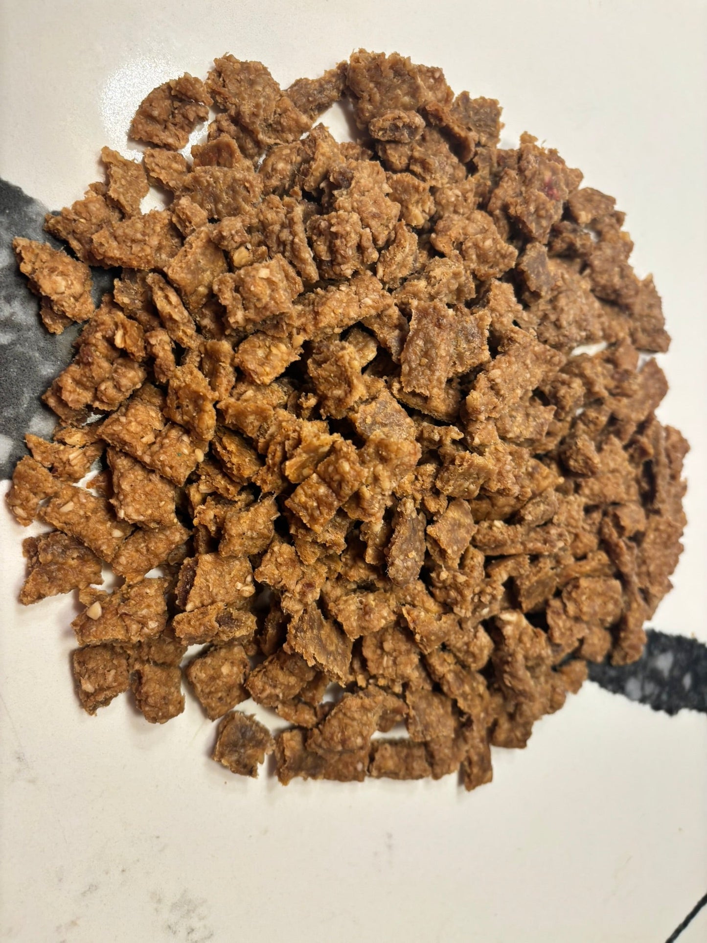 Organic beef training treats for dogs from PAWsitively Organic Dog Bakery, high-value training bites in a close-up shot.