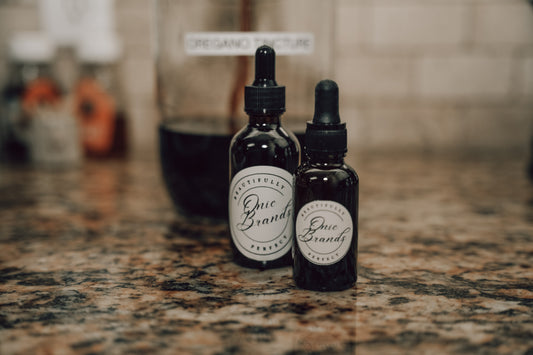 Onic Brands Elemental Oregano Tincture bottle with dropper, natural herbal supplement for wellness and immune support.