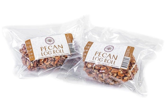 Millican Pecan Log Rolls, delicious pecan treats with a flaky pastry exterior and rich pecan filling, arranged on a platter.