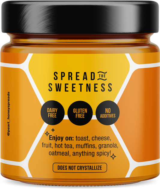 Creamed honey jar with pumpkin spice flavor from Pearl Honey Spreads, featuring a label with pumpkin and spice design.
