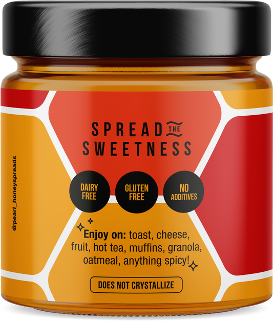 Spicy creamed honey jar from Pearl Honey Spreads with a label and honey spread visible on the lid.