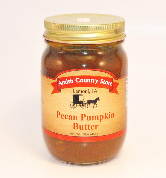 Canned Pecan Pumpkin Butter from Amish Country Store shown in a 16oz jar with a spoonful of the spread on a plate.
