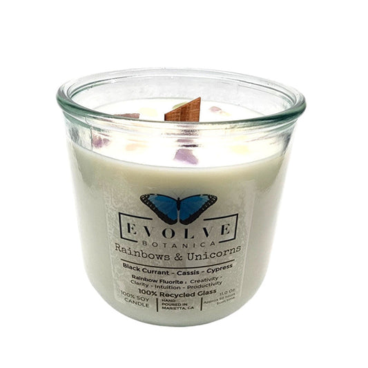 Rainbows and unicorns design on a soy candle with rainbow fluorite gemstone and wooden wick, by Evolve Botanica.