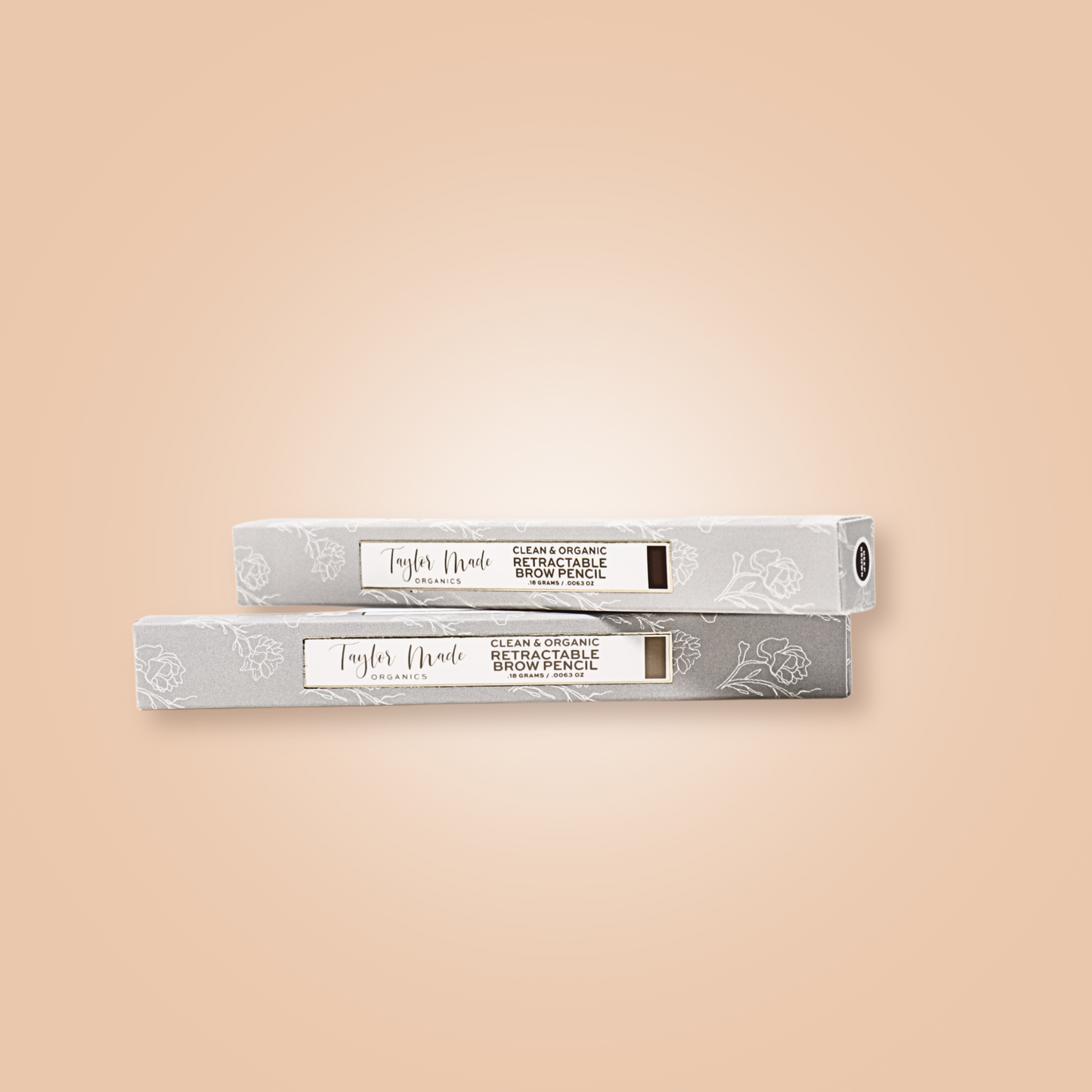 Taylor Made Organics retractable brow pencil with box, features precise tip for natural-looking eyebrow enhancement.