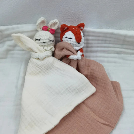 Baby bib with sleeping animals and rattle, soft fabric by Petite Pioneers, featuring cute animal designs for infants.