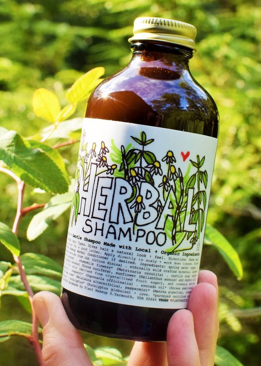 Herbal shampoo by Plant Makeup with natural plant extracts, shown in a clear bottle with a pump dispenser.