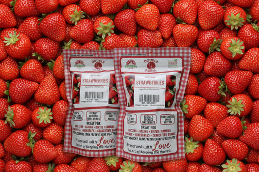Freeze dried strawberries from Double L Ranch, showcasing vibrant red, crispy slices of fresh fruit on a white background.