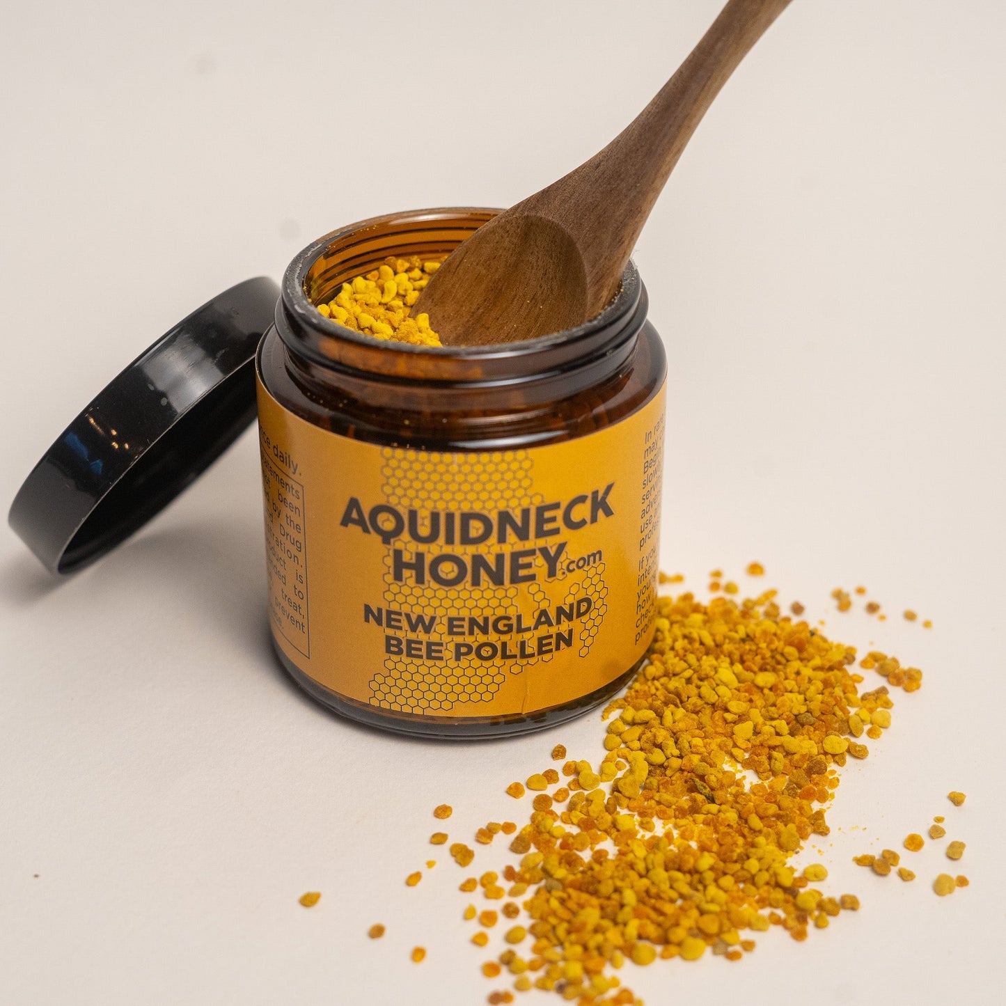 Pure raw bee pollen from Aquidneck Honey, showcasing colorful granules collected from bees in NH, RI, and MA.