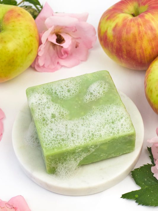 Ash & Rose Apple Rose Soap Scrub Bar, natural bar soap with a pink rose scent, featuring a textured surface and floral packaging.