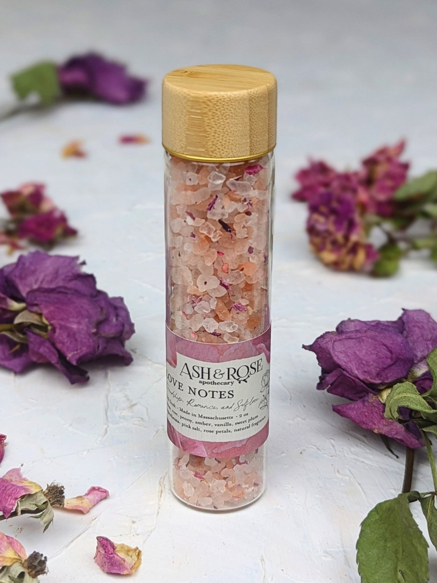 Ash & Rose Love Notes Bath Soak vial featuring aromatic bath soak with floral and herbal ingredients in a small glass vial.