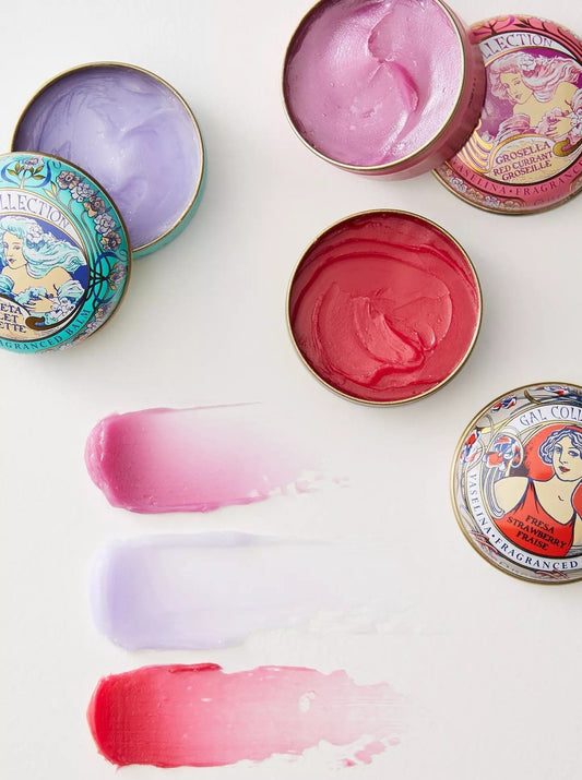 Ash & Rose Perfumeria Gal scented lip balm in orange flavor, featuring a smooth, moisturizing texture in a sleek packaging