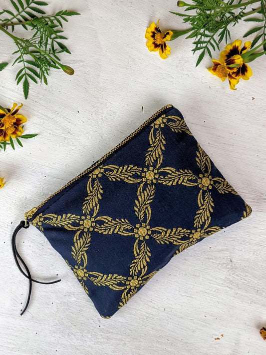 Royal blue Ash & Rose clutch purse with sleek design and gold clasp, perfect for elegant occasions.
