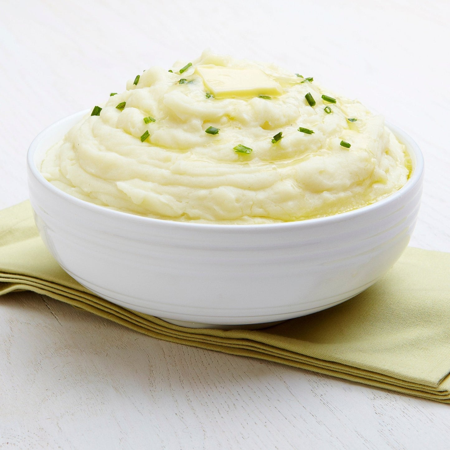 Augason Farms instant mashed potatoes can with 30 servings, showing a white can with label and serving suggestion on the front.