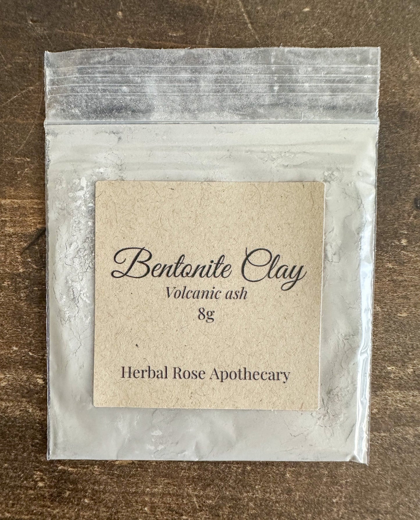 Herbalroseapothecary Bentonite Clay Powder in an 8g container, natural mineral clay for skincare and detox treatments.