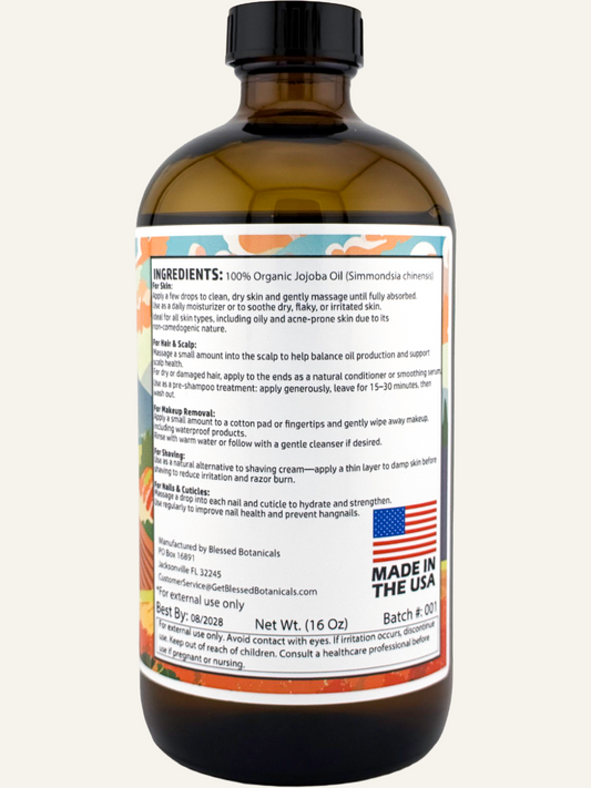 Back label of Blessed Botanicals Organic Jojoba Oil bottle, showing the product packaging and branding details.