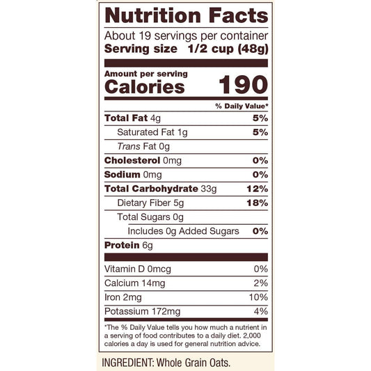 Organic gluten-free rolled oats from Bob's Red Mill, displayed in a clear bowl on a wooden surface, with oats scattered nearby.