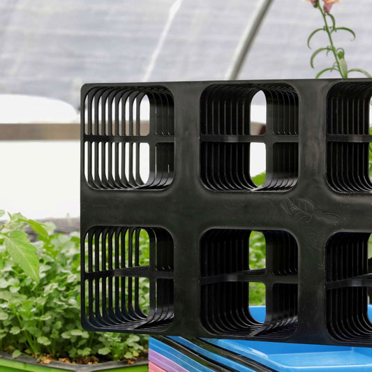 Bootstrap Farmer insert tray holding 5-inch pots for efficient seed starting and plant cultivation.