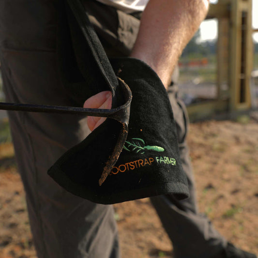 Bootstrap Farmer Workhorse Garden Towel with durable, absorbent fabric shown, ideal for gardening tasks and outdoor use.