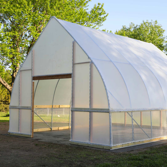 DIY Gothic Greenhouse Kit by Bootstrap Farmer featuring a sturdy green metal frame and clear panels for plant cultivation.