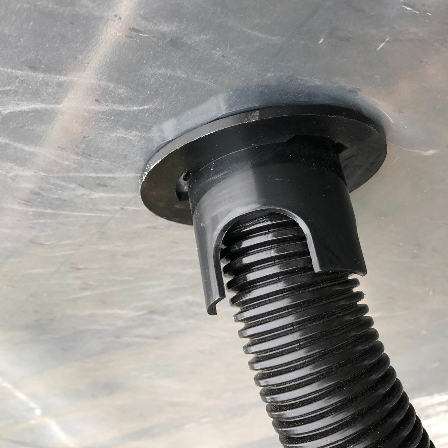 Greenhouse kit with Bootstrap Farmer air inflation jumper hose in green, used for efficient irrigation and climate control.