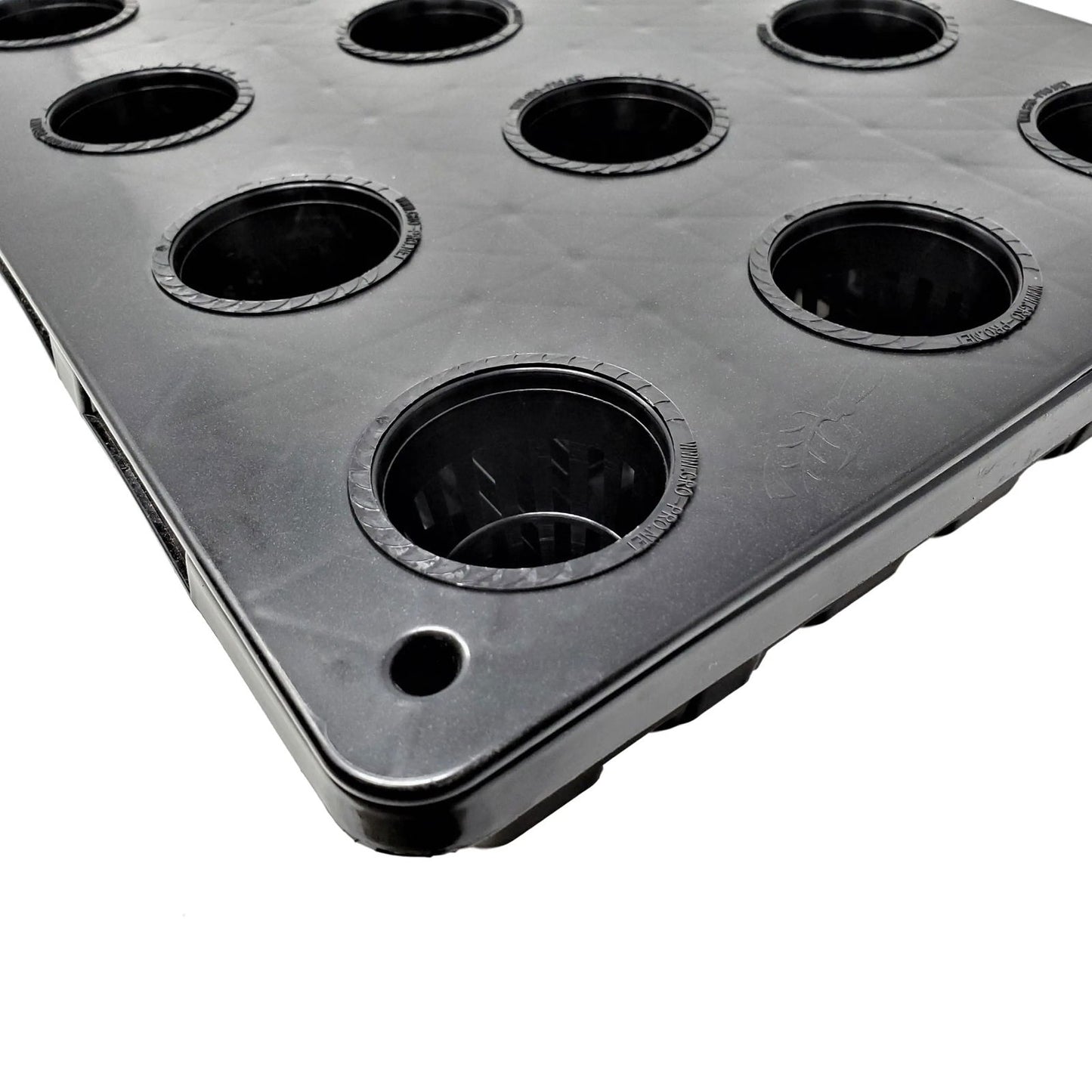 Plastic hydroponic grow tray showing multiple black net pots with textured rims and a subtle logo detail