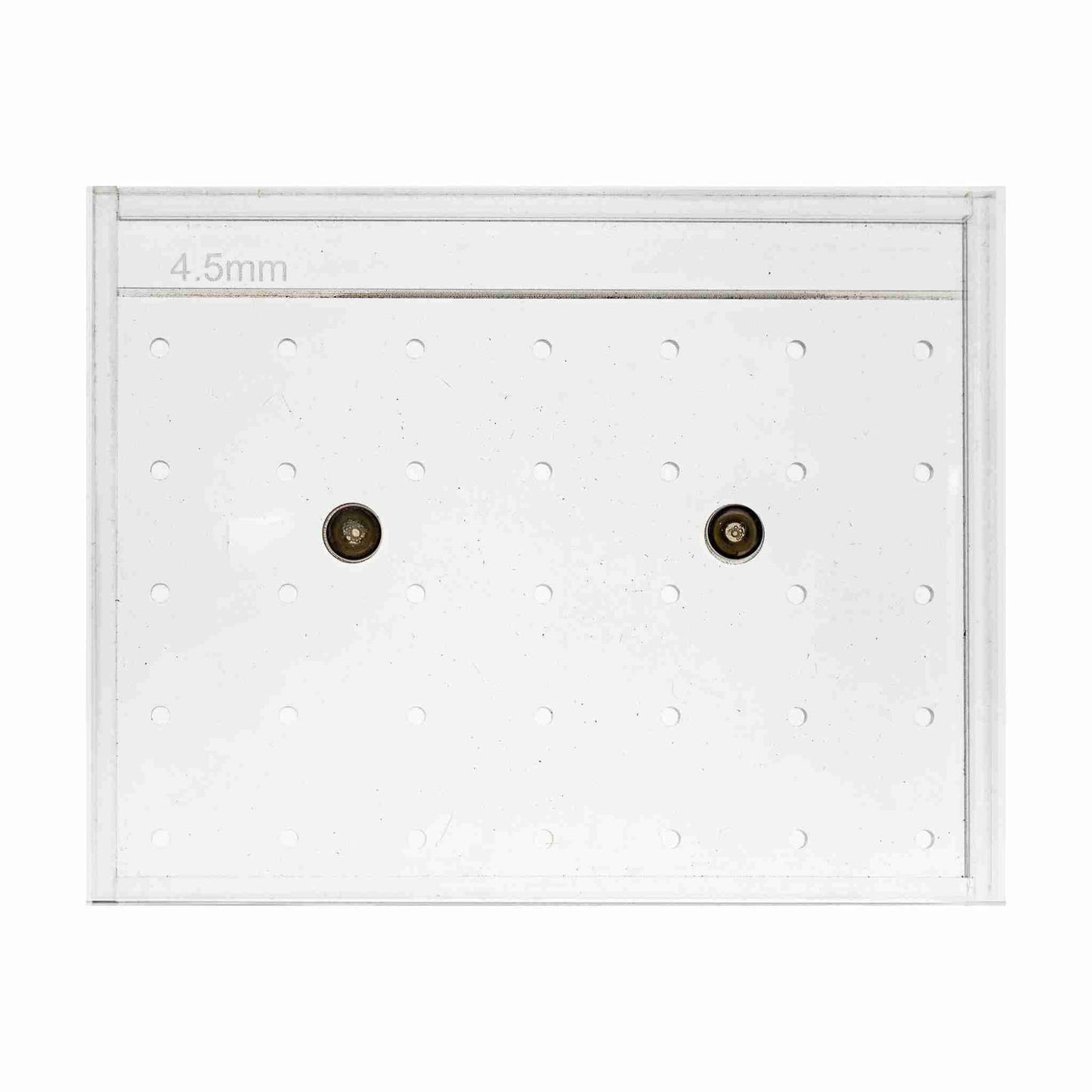 The Bootstrap Farmer Soil Block Drop Seeder - Standing 35 - Complete Set by Mindful Farmer is a clear rectangular acrylic board with small evenly spaced holes, two metal pins, and a "4.5mm" label at the top left corner.