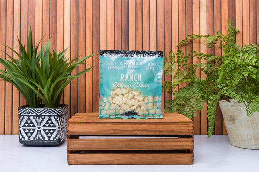 Wisconsin Cheese Brothers Inc. cheese curds sampler with 8 fresh-pack cheese curds in a gift bundle, ready for enjoyment.