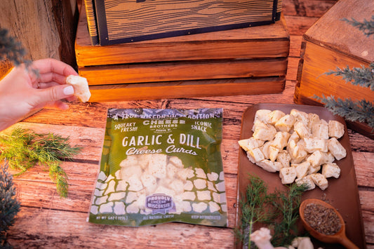 Garlic and dill cheese curds from Cheese Brothers, Inc., fresh-packed and ready to enjoy.