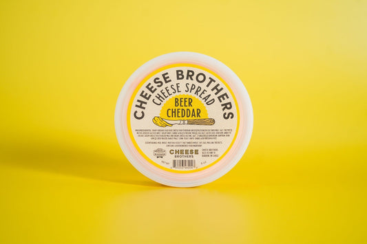 Beer Cheddar Cheese Spread by Cheese Brothers, Inc., creamy cheese spread with beer flavor in a jar.