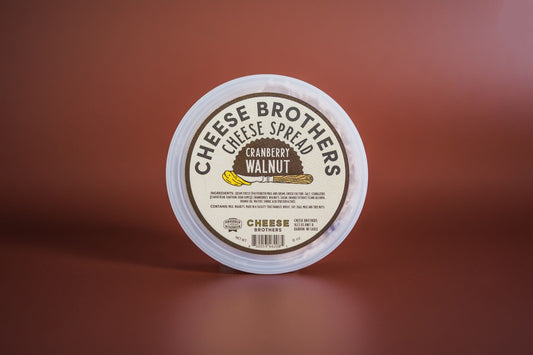 Creamy cranberry walnut cheese spread by Cheese Brothers, Inc., with visible cranberry pieces and walnut chunks in a smooth spread