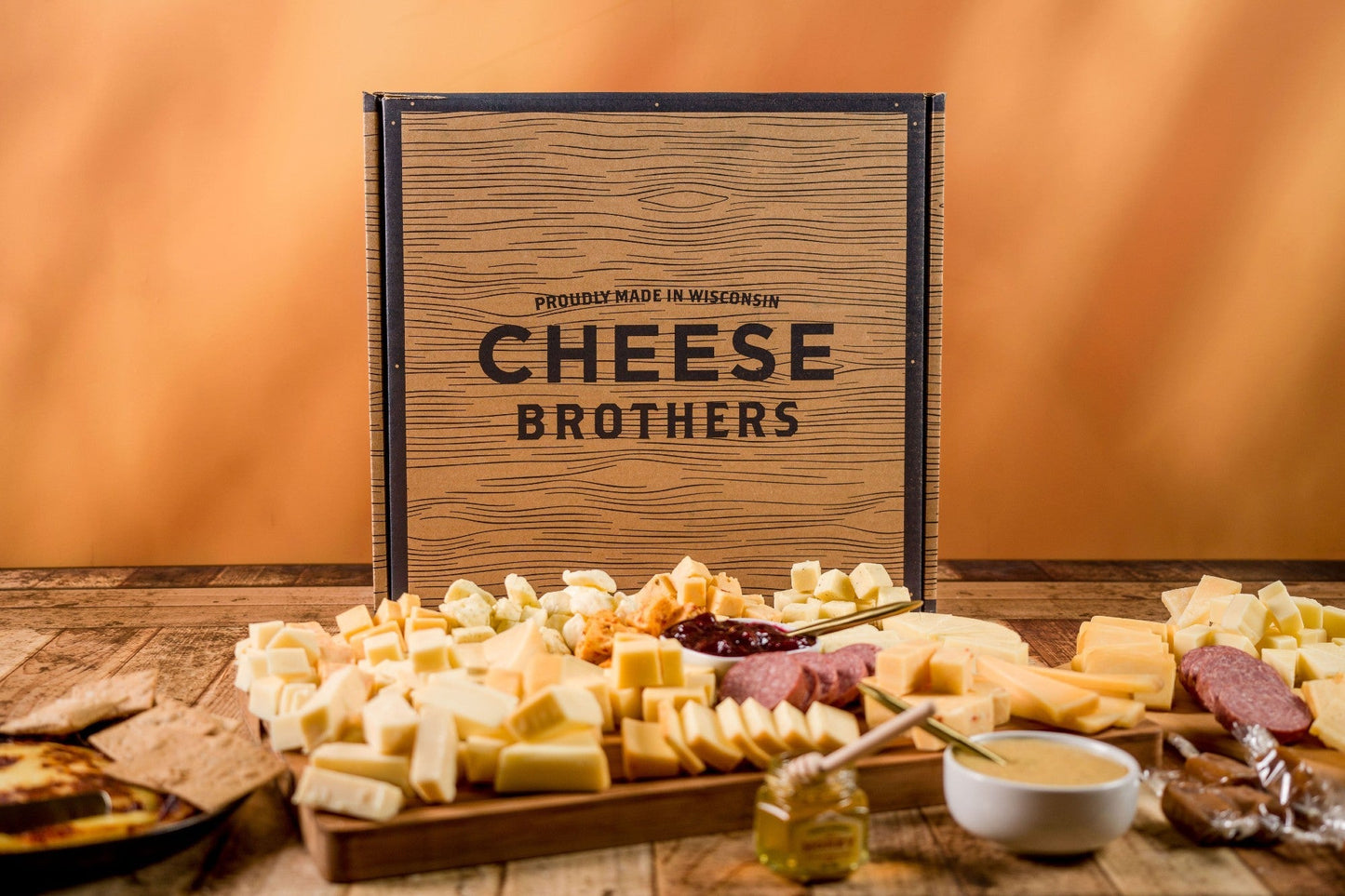 Cheese Brothers, Inc. Just About Everything Box gift bundle featuring assorted cheeses and snacks in a decorative box.