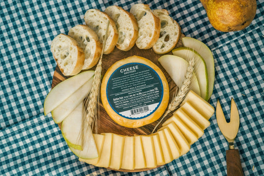 Bluegrass Bourbon Gouda cheese from Cheese Brothers, Inc., showcasing a smooth, creamy gouda with bourbon infusion.